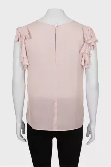 Beige tank top decorated with frills