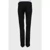 Dark grey trousers with arrows