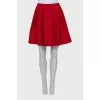 Red pleated skirt