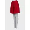 Red pleated skirt