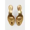 Golden Mules with a stiletto
