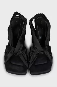 Textile sandals with a figured heel