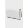 White leather wallet with tag