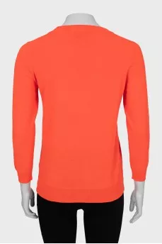 Knitted jumper in orange color