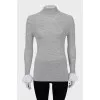 Wool turtleneck with ruffles on the sleeves
