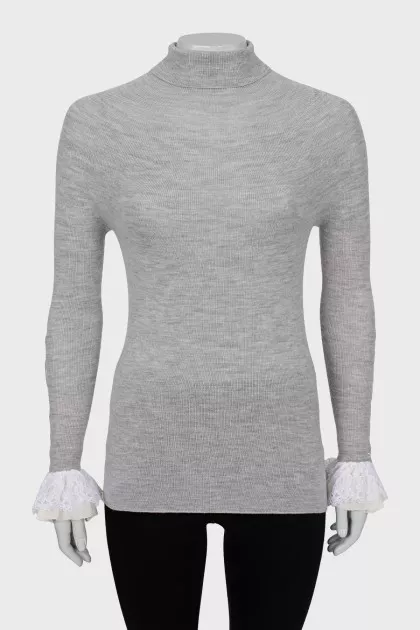 Wool turtleneck with ruffles on the sleeves