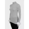 Wool turtleneck with ruffles on the sleeves