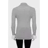 Wool turtleneck with ruffles on the sleeves