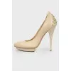 Beige studded pumps