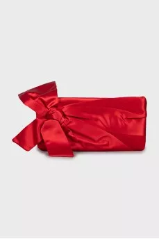 Textile clutch decorated with a bow
