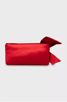 Textile clutch decorated with a bow