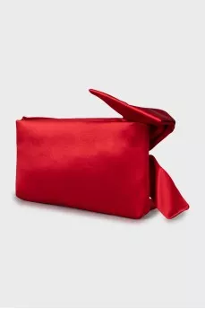 Textile clutch decorated with a bow