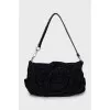 Suede bag decorated with a flower