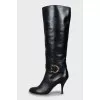 Leather boots with gold buckle