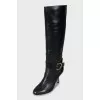 Leather boots with gold buckle