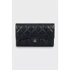 Quilted wallet with brand logo