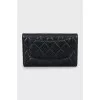 Quilted wallet with brand logo