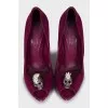 Suede shoes decorated with a skull