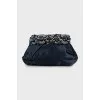 Clutch decorated with rhinestones and drapery