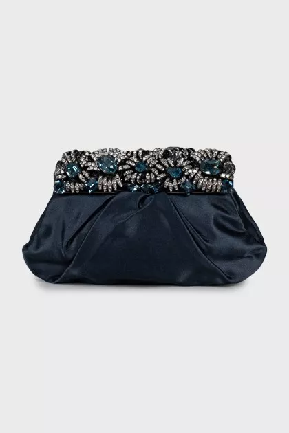 Clutch decorated with rhinestones and drapery