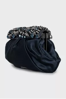 Clutch decorated with rhinestones and drapery