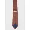 Orange tie in small print
