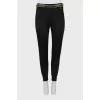 Slim fit trousers with waistband decoration