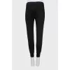 Slim fit trousers with waistband decoration