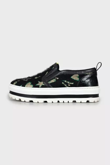 Textile slip-ons on a high platform