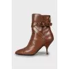 Brown ankle boots with leather straps