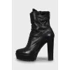 Leather ankle boots decorated with buckles