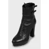 Leather ankle boots decorated with buckles