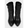 Leather ankle boots decorated with buckles