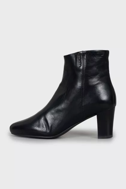 Black leather ankle boots with logo