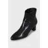 Black leather ankle boots with logo