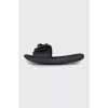 Black flip flops decorated with flowers
