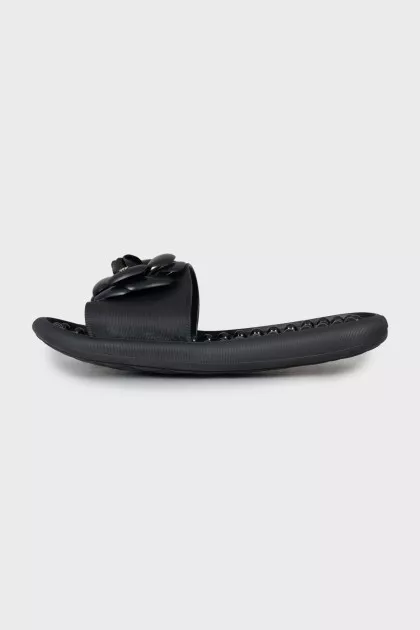 Black flip flops decorated with flowers