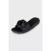 Black flip flops decorated with flowers