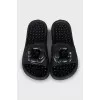 Black flip flops decorated with flowers