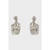 Silver earrings with tag