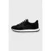 Sneakers with branded embossing on suede