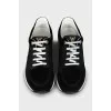 Sneakers with branded embossing on suede