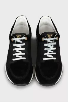 Sneakers with branded embossing on suede
