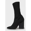 Ankle boots made of textile with a figured heel