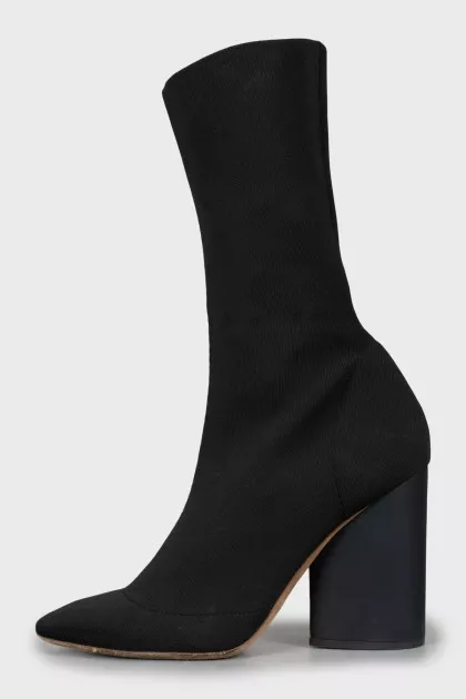 Ankle boots made of textile with a figured heel
