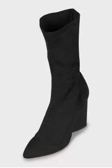 Ankle boots made of textile with a figured heel