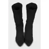 Ankle boots made of textile with a figured heel