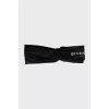 Headband with silver logo and tag