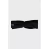 Headband with silver logo and tag