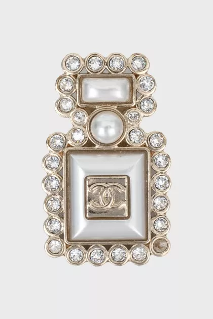 Bottle shaped brooch with logo